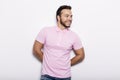 Young handsome fitness man in pink shirt, studio shot. Royalty Free Stock Photo