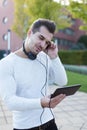 Man listening music by headphones in park enjoying rythm Royalty Free Stock Photo
