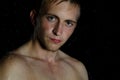 Young handsome guy in shower. Water, cleanliness and freshness Royalty Free Stock Photo