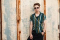 Young handsome guy with sunglasses in stylish beach clothes Royalty Free Stock Photo