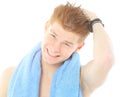 Young handsome guy wipes the hair with a towel after shower Royalty Free Stock Photo