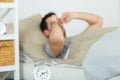 young handsome happy man waking up on bed Royalty Free Stock Photo