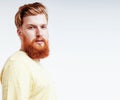 Young handsome hipster ginger bearded guy looking brutal isolate Royalty Free Stock Photo