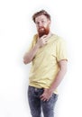 Young handsome hipster ginger bearded guy looking brutal isolated on white background, lifestyle people concept Royalty Free Stock Photo