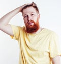 Young handsome hipster ginger bearded guy looking brutal isolated on white background, lifestyle people concept Royalty Free Stock Photo