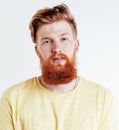 young handsome hipster ginger bearded guy looking brutal isolated on white background, lifestyle people concept Royalty Free Stock Photo