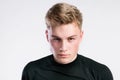 Young handsome hipster man in black t-shirt, studio shot. Royalty Free Stock Photo