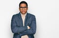 Young handsome hispanic man wearing business jacket and glasses skeptic and nervous, disapproving expression on face with crossed Royalty Free Stock Photo