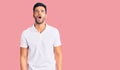 Young handsome hispanic man wearing casual clothes angry and mad screaming frustrated and furious, shouting with anger Royalty Free Stock Photo