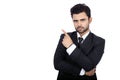 Young handsome Indian businessman wearing an elegant suit pointing at copy space Royalty Free Stock Photo