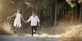 Young handsome Indian couple walking through field Royalty Free Stock Photo