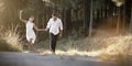 Young handsome Indian couple walking through field Royalty Free Stock Photo