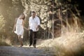 Young handsome Indian couple walking through field Royalty Free Stock Photo