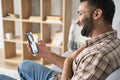 Young handsome indian guy having videocall dating online. Royalty Free Stock Photo