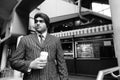 Young handsome Indian Sikh businessman drinking coffee at the store Royalty Free Stock Photo