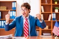 The young handsome politician sitting in office