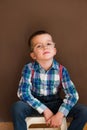 Young handsome kid smiling with blue shirt and suspenders Royalty Free Stock Photo