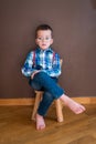 Young handsome kid smiling with blue shirt and suspenders Royalty Free Stock Photo