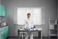 Young handsome male chemist working in a bright lab Royalty Free Stock Photo