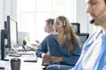 Young handsome male customer support phone operator with headset working in call center Royalty Free Stock Photo