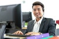 Young handsome male customer support phone operator with headset working in call center. Professional operator concept Royalty Free Stock Photo