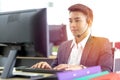 Young handsome male customer support phone operator with headset working in call center. Professional operator concept Royalty Free Stock Photo