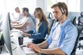 Young handsome male customer support phone operator with headset working in call center Royalty Free Stock Photo