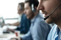 Young handsome male customer support phone operator with headset working in call center Royalty Free Stock Photo