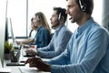 Young handsome male customer support phone operator with headset working in call center Royalty Free Stock Photo