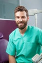 Young handsome male doctor with beard smiling with white teeth Royalty Free Stock Photo