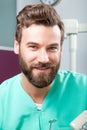 Young handsome male doctor smiling with white teeth. Royalty Free Stock Photo