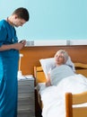 Young handsome male doctor in uniform with phonendoscope on his Royalty Free Stock Photo