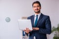 Young handsome businessman employee working in the office Royalty Free Stock Photo