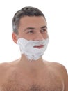 Young handsome male shaving face beard . isolated