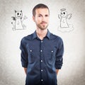Young handsome man with angel and devil Royalty Free Stock Photo