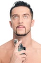Young handsome man applying perfume Royalty Free Stock Photo