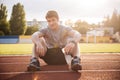 Young handsome man athlete resting with water bottle Royalty Free Stock Photo