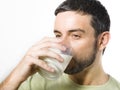 Young Handsome Man with Beard drinking Milk Royalty Free Stock Photo
