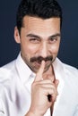 Young handsome man with beard and mustache showing hush sign Royalty Free Stock Photo