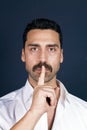 Young handsome man with beard and mustache showing hush sign Royalty Free Stock Photo