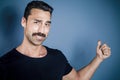 Young handsome man with beard and mustache studio portrait Royalty Free Stock Photo