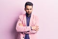 Young handsome man with beard wearing elegant jacket skeptic and nervous, disapproving expression on face with crossed arms Royalty Free Stock Photo