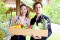 Young handsome man and beautiful girlfriend shop organic food farm market. Happy tourist couple buy fresh harvest fruit and Royalty Free Stock Photo