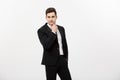 Young handsome man in black suit and glasses looking at copy-space smiling,thinking or dreaming isolated over white Royalty Free Stock Photo