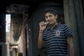 Young handsome man brush his teeth at corridor of his home. Royalty Free Stock Photo