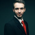 Young handsome man (businessman) in black suit wit Royalty Free Stock Photo