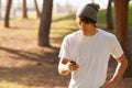 Young handsome man consulting phone outdoors Royalty Free Stock Photo