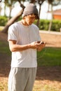 Young handsome man consulting phone outdoors Royalty Free Stock Photo