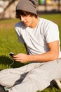 Young handsome man consulting phone outdoors Royalty Free Stock Photo