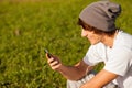 Young handsome man consulting phone outdoors Royalty Free Stock Photo